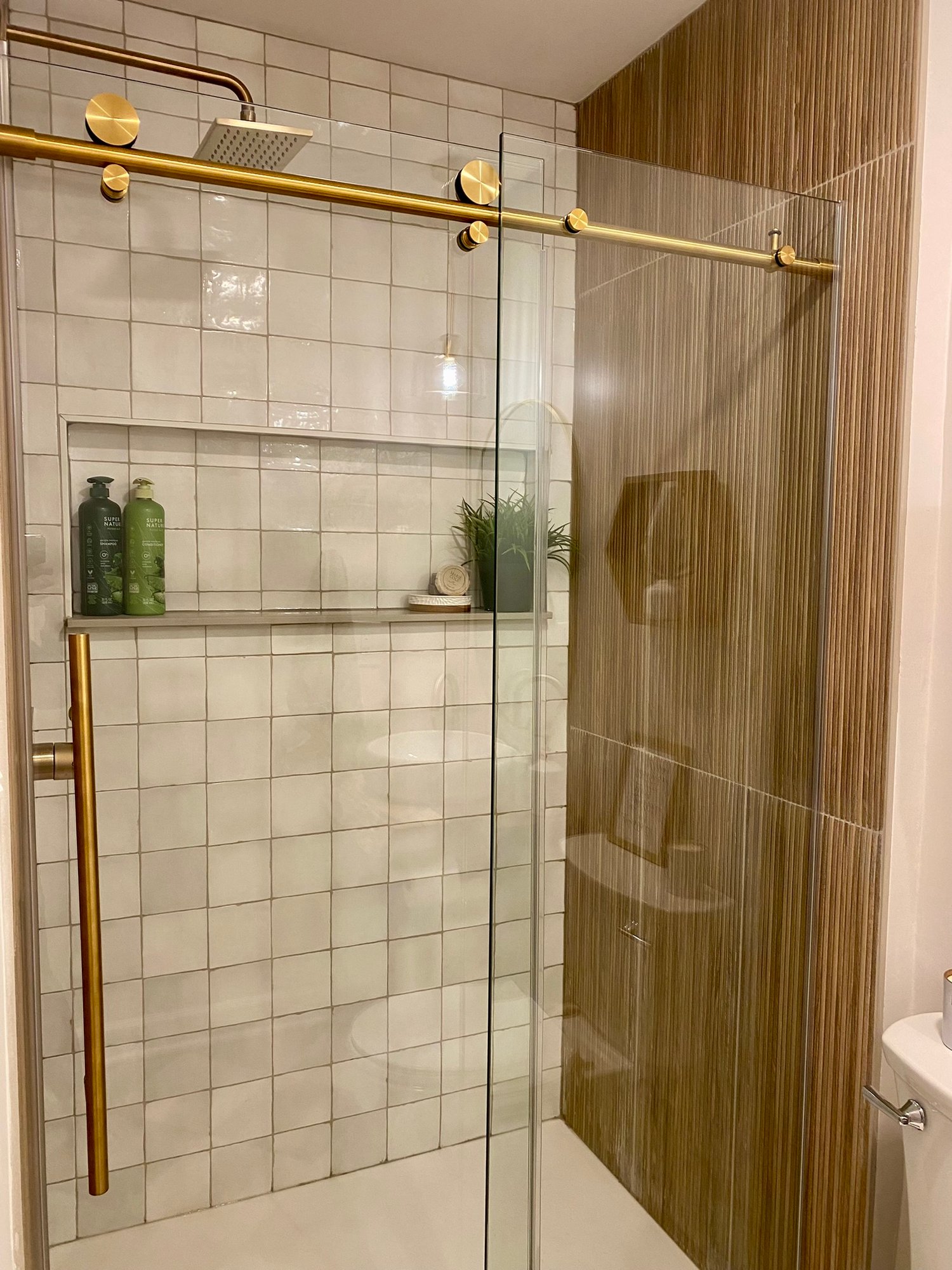 Lake Anna-shower-door-gold-hardware-spa-zellige-fluted-tile-bathroom-renovation